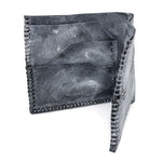 a closed seam 6 pocket bifold wallet crafted from a supple matte black kangaroo leather with a contrasting pigmented wax finish available to buy online from artisanal leather studio atelierskn.com