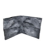 a closed seam 6 pocket bifold wallet crafted from a supple matte black kangaroo leather with a contrasting pigmented wax finish available to buy online from artisanal leather studio atelierskn.com