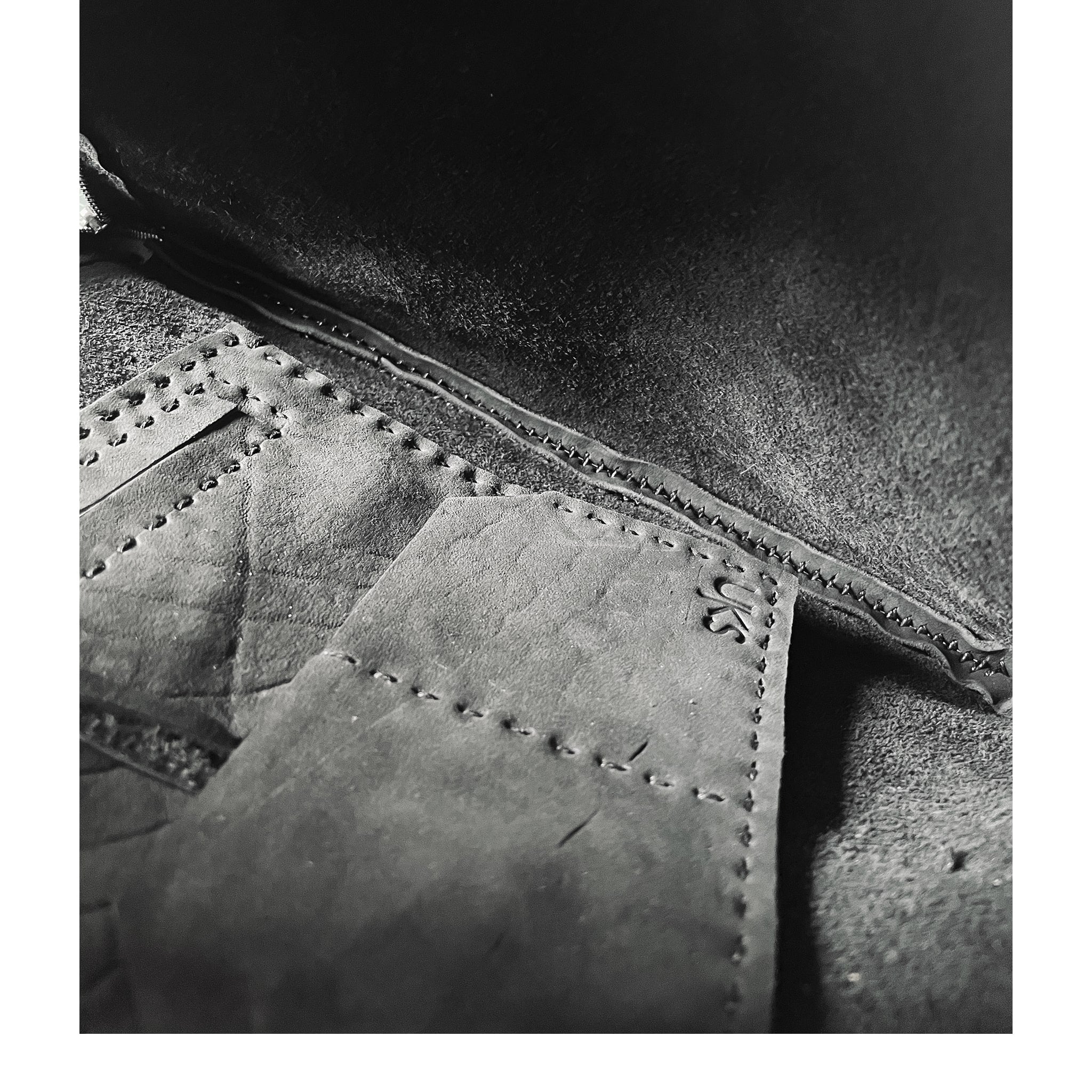 hand sewn avant garde black leather shoulder bag from atelier skn.